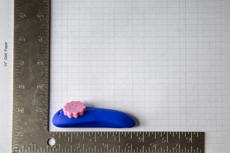 Romp Party Dimensions Photo - Product Set On Graph Paper With Carpenter Square to See Size