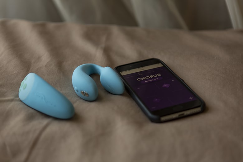 We-Vibe Chorus Remote and App Sitting on Pillow