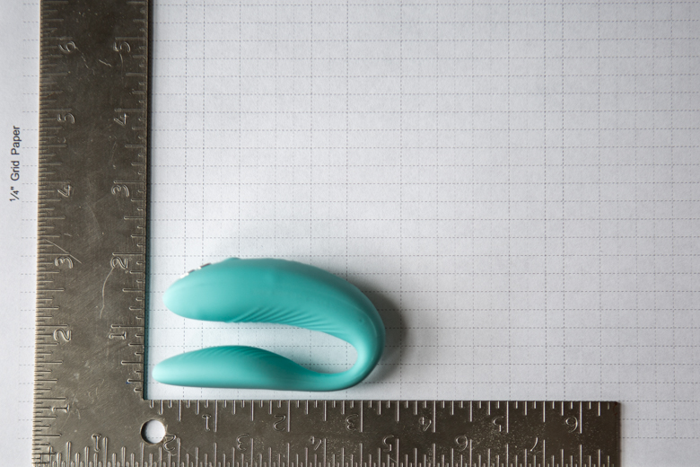 We-Vibe Sync Dimensions Photo - Product Set On Graph Paper With Carpenter Square to See Size